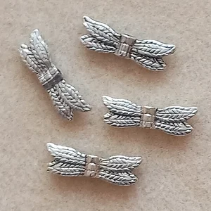 4, 20mm metal dragonfly wings, silver plated.