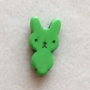 Dyed howlite rabbit bead, green, 25mm x 12mm
