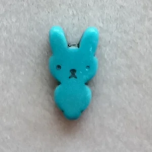 Dyed howlite rabbit bead, turquoise, 25mm x 12mm