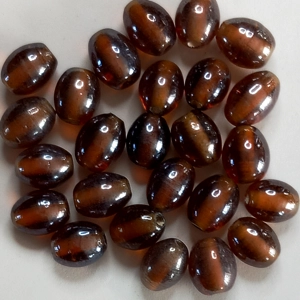 25, transparent dark amber, Indian glass beads, oval 9 x 11mm