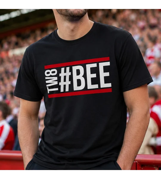 Bee Hashtag Fan T-Shirt — Black 100% cotton football fan T-shirt featuring bold white “#BEE” lettering with vertical “TW8” text and red horizontal stripes across the chest.