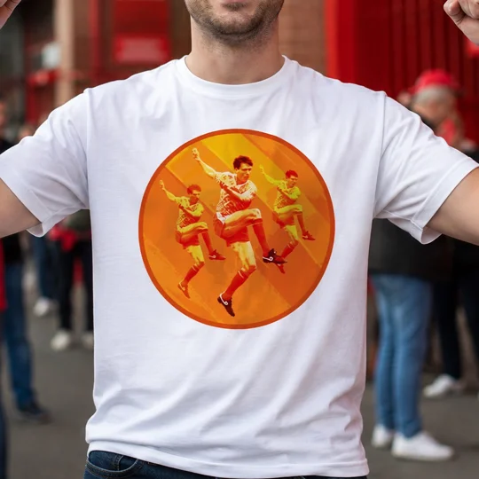White football T-shirt featuring a retro orange and yellow football player design, modelled by a fan outside a stadium