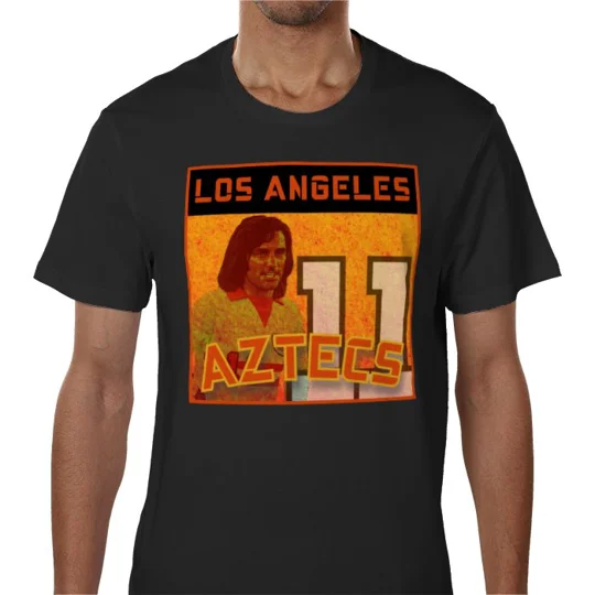 Close-up of the full-colour George Best-inspired artwork on a black Los Angeles Aztecs retro football T-shirt.