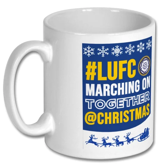 White 10oz Leeds United-inspired Christmas football mug with glossy full-colour artwork, ideal for Leeds fans
