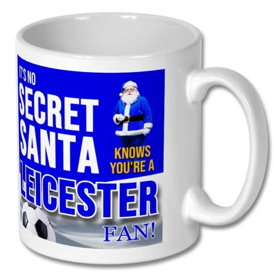 Close-up of the Leicester City-inspired football artwork on a white ceramic Christmas mug
