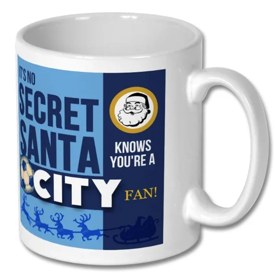 White Manchester City-inspired Christmas mug featuring festive football gift artwork, ideal for a Secret Santa present