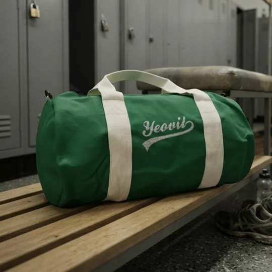 Yeovil Town-inspired retro football holdall with embroidered design and detachable shoulder strap.