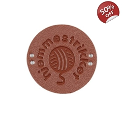 Skinn merke med tekst 