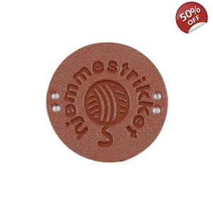 Skinn merke med tekst 