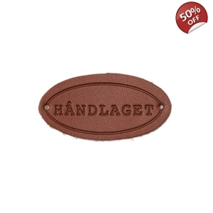 Skinn merke med tekst 