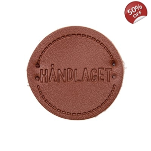 Skinn merke med tekst 