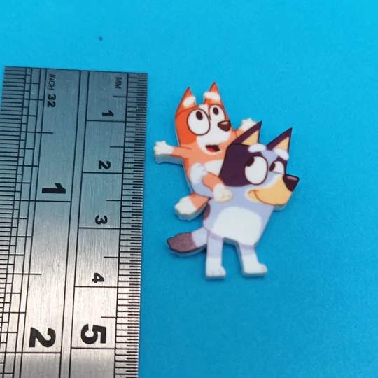 Bluey and Bingo pin badge