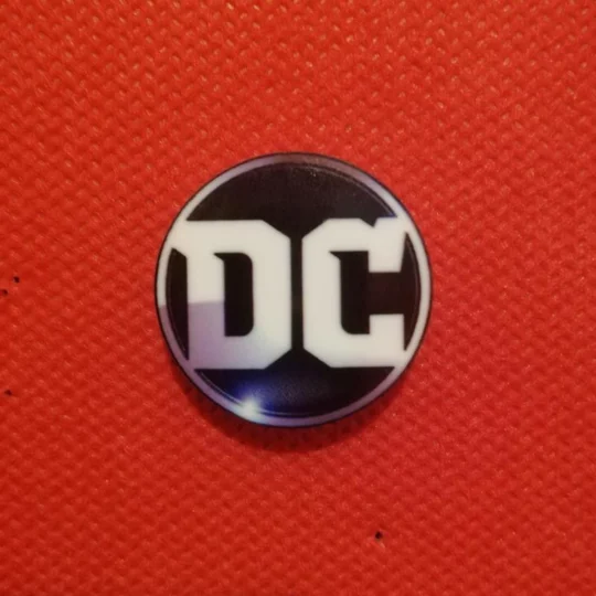 DC logo pin badge
