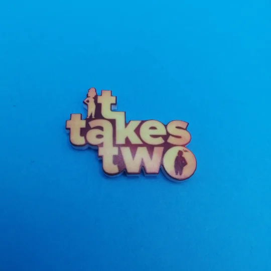 It Takes Two logo pin badge