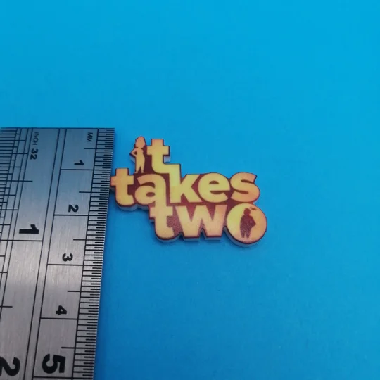 It Takes Two logo pin badge