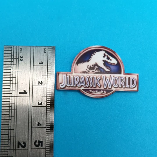 Jurassic World logo pin badge