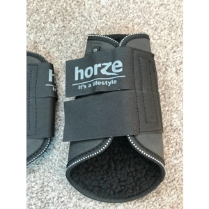 Pony sized Horze Black fleece lined brushing boots.