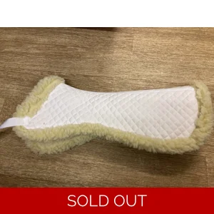 White faux sheepskin half pad. Shop soiled. 20.5” along spine
