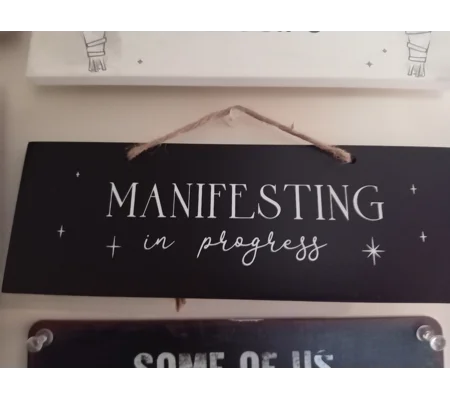 Manifesting in Progress sign