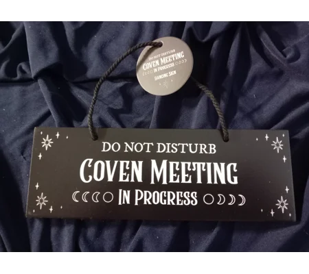 Coven meeting in progress sign