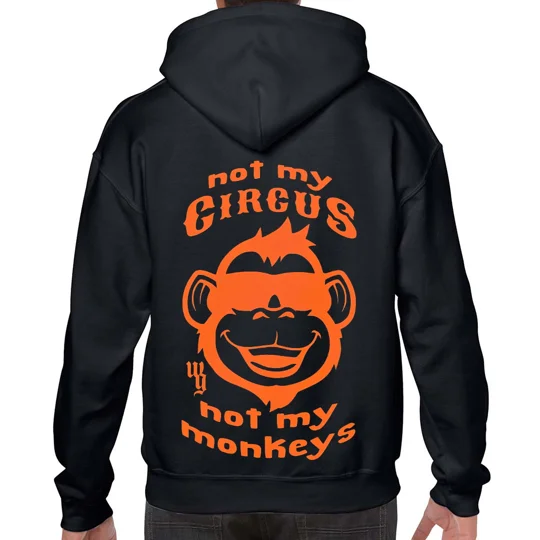 black hoodie with orange text top and bottom reading not my circus not my monkeys with an orange monkey in the centre smiling wearing sunglases of the hoodie
