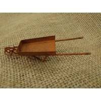 Miniature rusty metal wheelbarrow