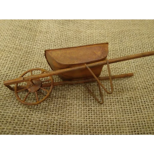 Miniature medium size rusty metal wheelbarrow