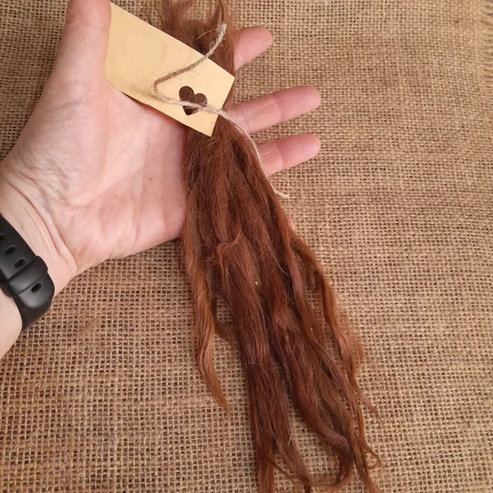 dark ginger suri locks