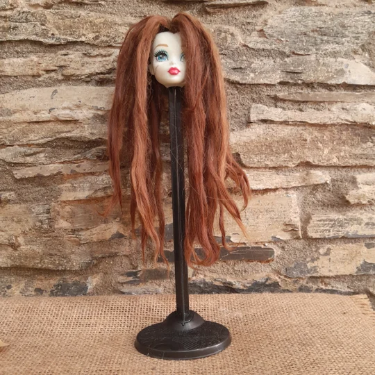 dark ginger alpaca on a doll