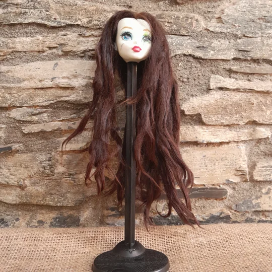 chestnut suri alpaca on a doll