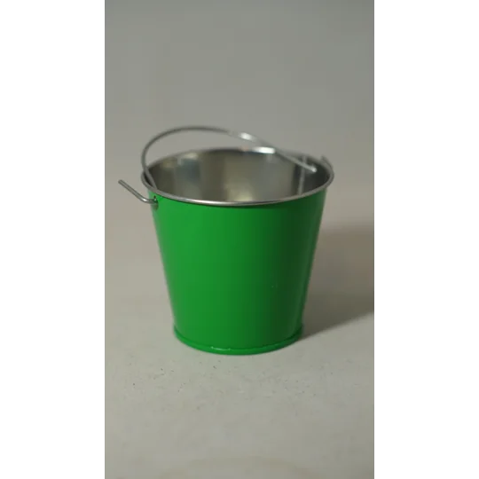 Small green metal bucket