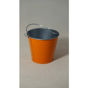 Small orange metal bucket