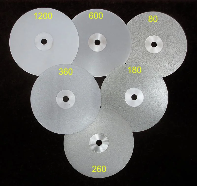 Diamond cutting and polishing laps for gemstone faceting