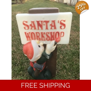 Elf Painting Santa’s Workshop Sign