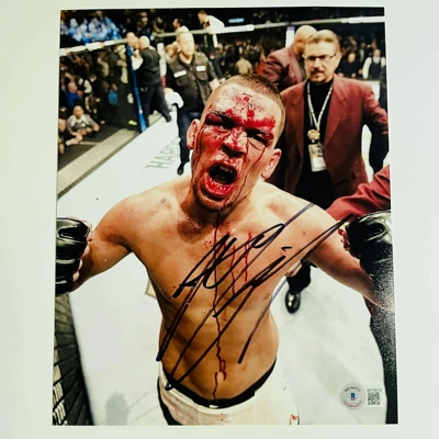NATE DIAZ SIGNED UFC 8x10 & BECKETT CERTIFIED BAS COA NATE DIAZ SIGNED UFC 8x10 & BECKETT CERTIFIED BAS COA