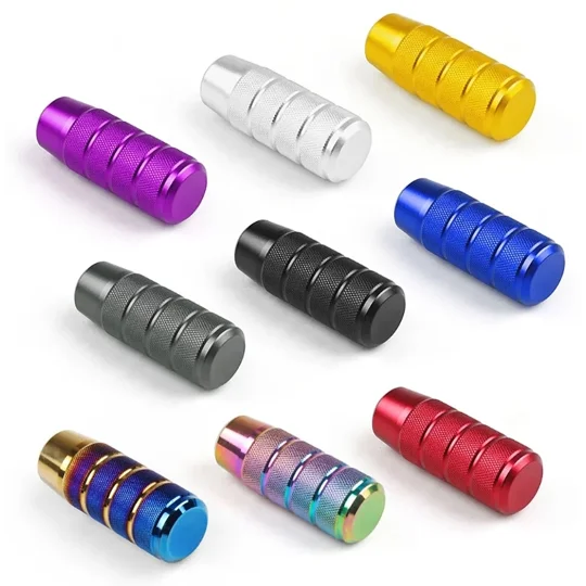 various coloured knurled style gear shifter knobs with no markings. colours are black, red, blue, gold, purple, silver, grey, bluegold and neo multicolour