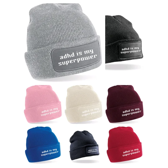 various coloured beanies with adhd is my superpower printed in white text, beanies colours of blue, navy, black, light grey, burgendy red, almond, red, and pink
