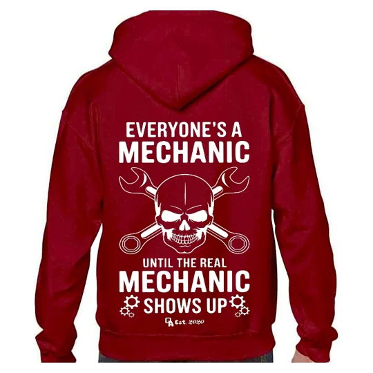 dark red hoodie with white printed image and text. a skull head with crossed spanners with text top and abive reading everyone's a mechanic until the real mechanic shows up