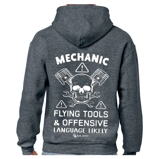 dark grey hoodie with white printed image and text. a skull with spanners and pistons surrounded by warning signs with text reading mechanic above and flying tools & offensive language likely underneath