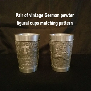 Pair of vintage German figural pewter cups 