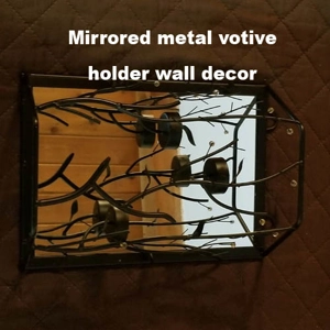 Black metal votive holding wall decor mirrored back