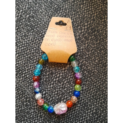 Glass beaded bracelet with central pink bead Glass beaded bracelet with central pink bead