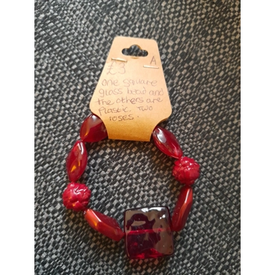 Red glass and plastic beaded bracelet Red glass and plastic beaded bracelet