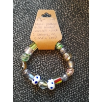 Glass bracelet with two dotted sp..