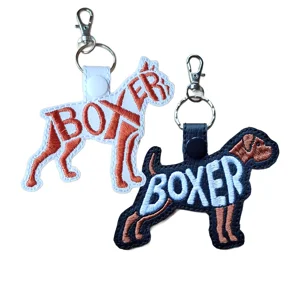 Black and white Boxer dog word art keyrings made from faux leather with embroidered breed lettering and sturdy metal keyring fittings.