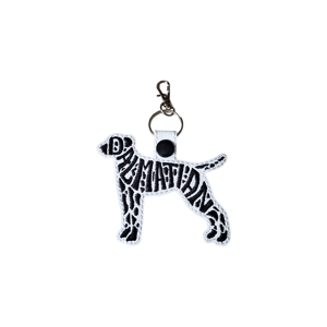 Dalmatian embroidered keyring in a standing silhouette, shown in white faux leather with black stitched lettering and a metal lobster clasp.