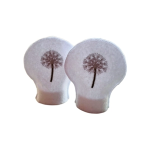 Set of two white felt Dandelion Clock tealight covers, delicately embroidered with a dandelion design, perfect for LED tealights and matching decorative table mats.