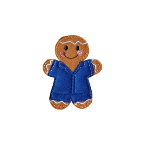 Handcrafted felt gingerbread character wearing a blue carer’s uniform, with embroidered white detailing and a cheerful smiling face, representing the Gingerbread Carer Character.