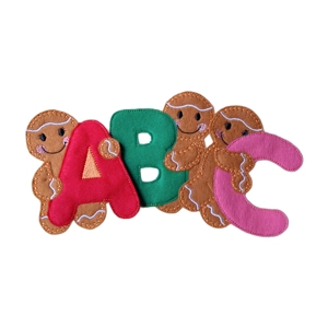 Handmade felt gingerbread characters holding colourful alphabet letters A, B, and C, each with embroidered details and smiling faces.
