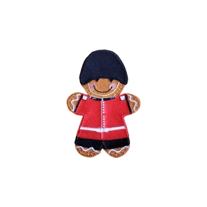 Gingerbread Grenadier Guard Character – a handmade felt gingerbread figure dressed as a Grenadier Guard, wearing a red uniform with black cuffs, gold buttons, and a tall black bearskin hat, featuring a smiling stitched face and fine embroidered details.